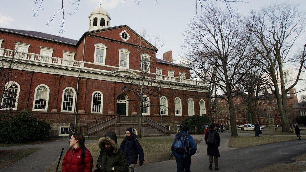 Harvard University students walk through the campus in Cambridge, Massachusetts.