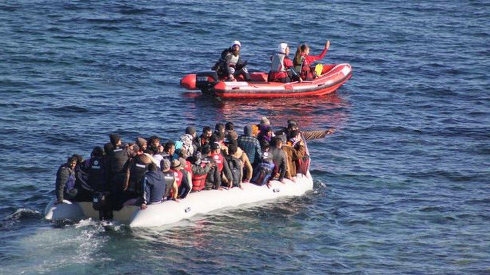 Robin Jenkins is at the helm of the Red Mist lifeboat assisting a boat of people from Turkey