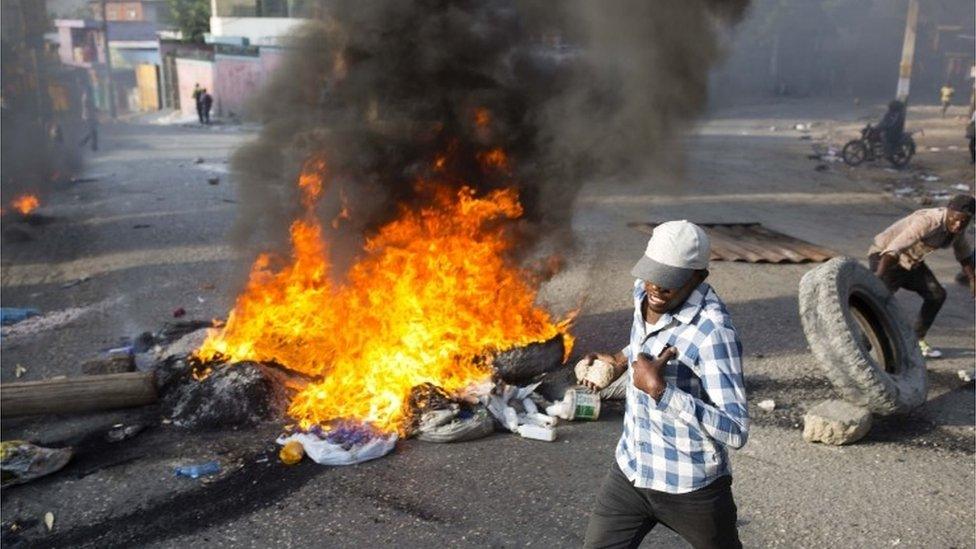 People protest over the cost of fuel in Port-au-Prince, Haiti, Friday, July 6, 2018.