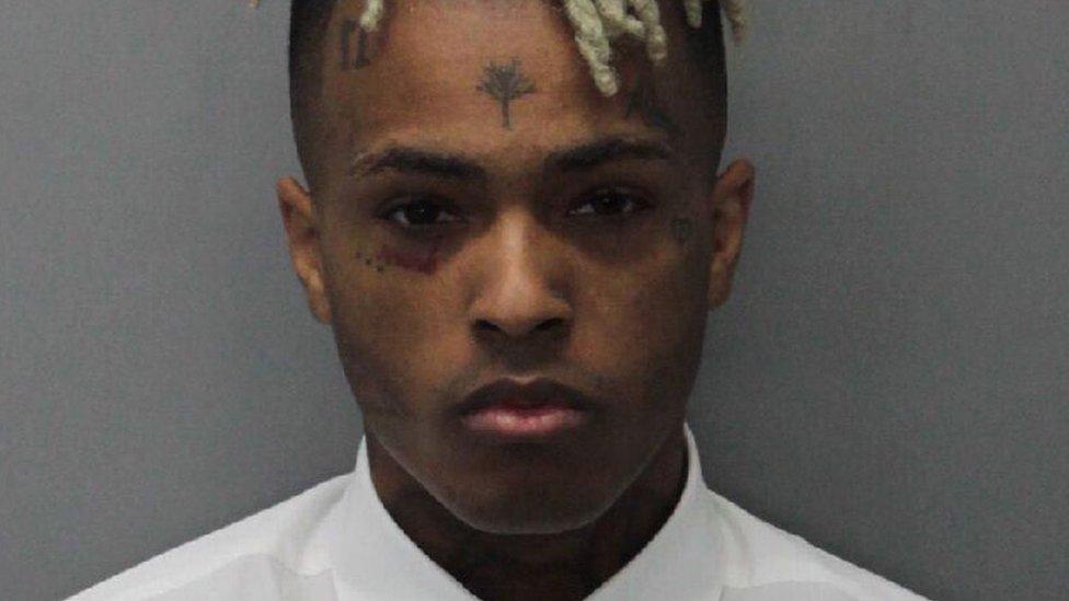 XXXTentacion, also known as Jahseh Dwayne Onfroy poses for his mugshot in 2017