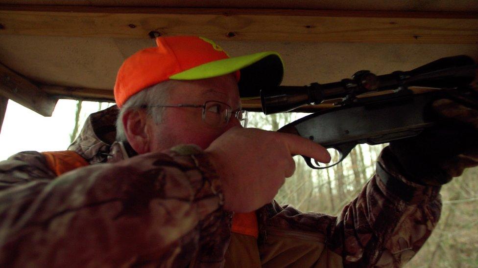 Man shooting a hunting rifle