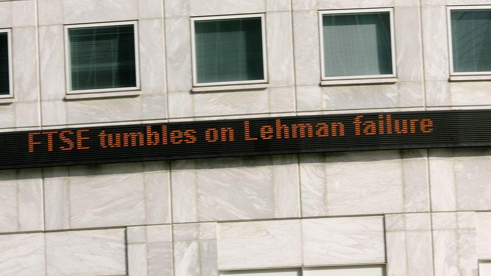 Sign reading "FTSE tumbles on Lehman failure"