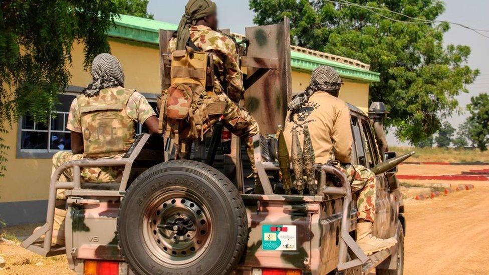 Nigerian Army soldiers are seen driving on a military vehicle in Ngamdu, Nigeria, on November 3, 2020