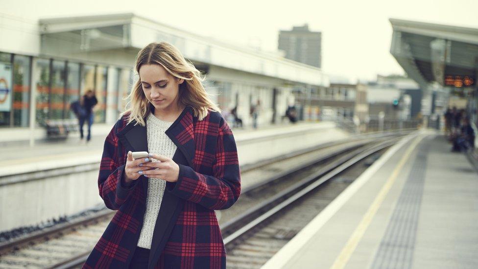 Woman on rail platform