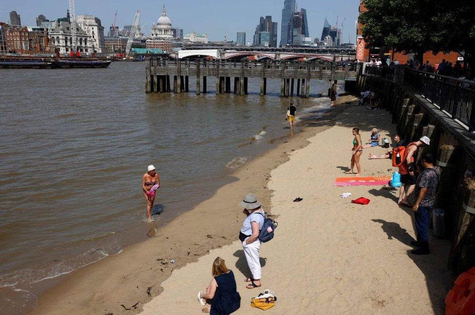 People paddling in Thames