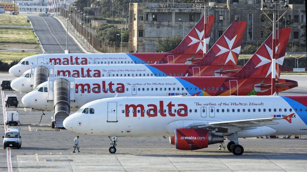 Four Air Malta planes in a row