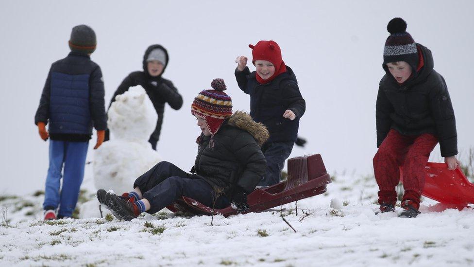 Children enjoying a bit of sledging in west Belfast