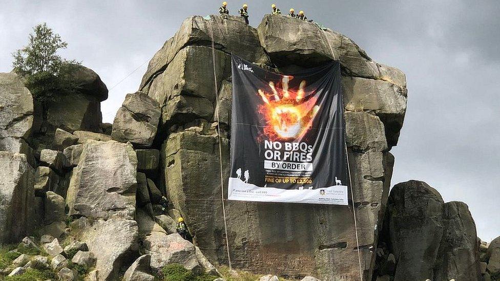 Cow and Calf rocks with banner