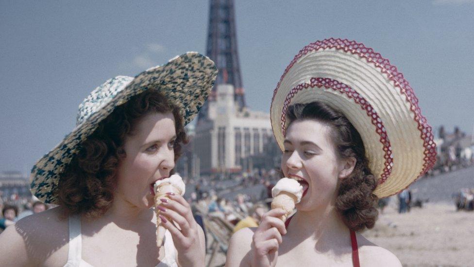 Two girls eating ice cream on Blackpool beach