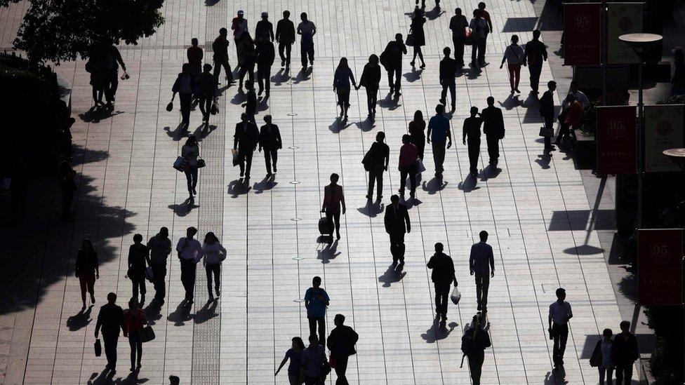 Pedestrians in central Shanghai (file photo - April 2013)