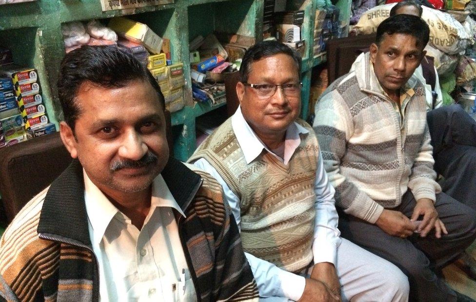 Santosh Kumar Gupta (front) in his shop