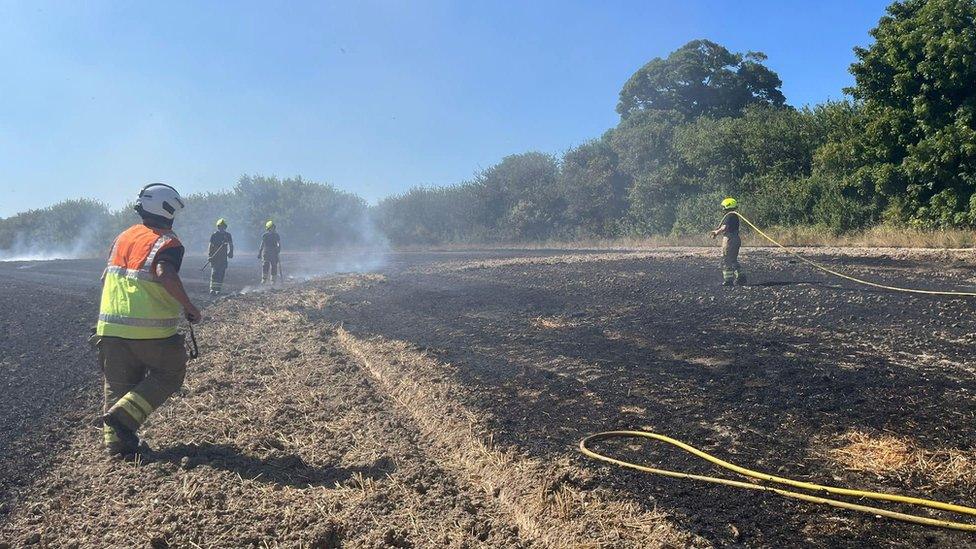 Firefighters tackling a field fire in Lower Sundon, Bedfordshire