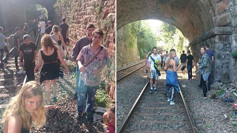 People on train tracks