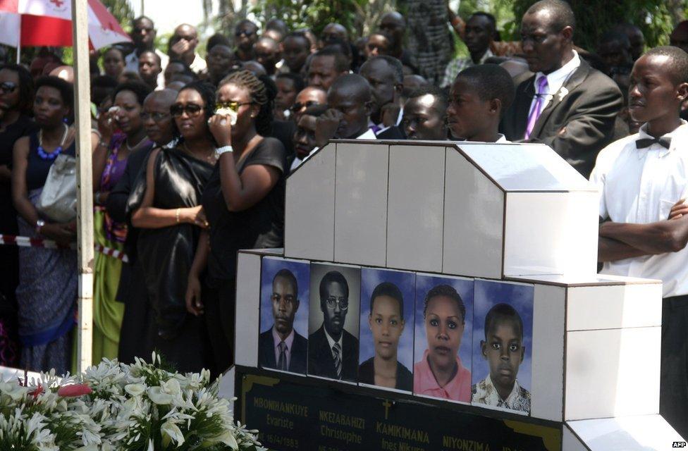 People attend the funeral of a Burundian journalist in Bujumbura on October 20, 2015, after they were shot dead on October 13