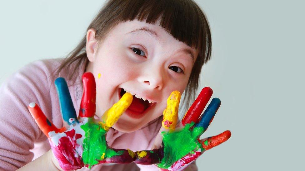 girl with paint on hands