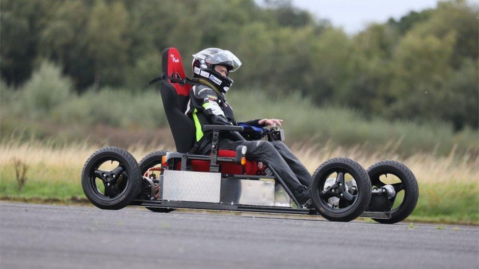 Mr Liversidge driving the chair