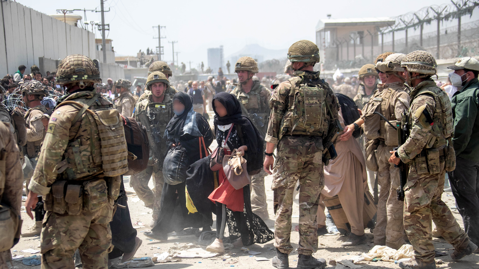 British troops in Afghanistan helping locals evacuate