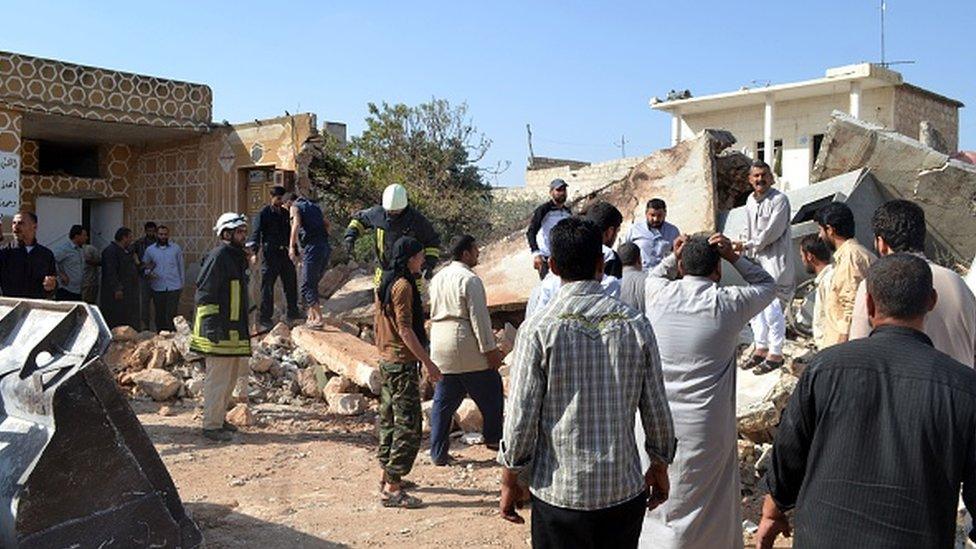 Rescuers search for casualties trapped under rubble after Russian war crafts hit Syrian opposition-controlled village of Kafr Karmin, Idlib, Syria on 16 October 2015.