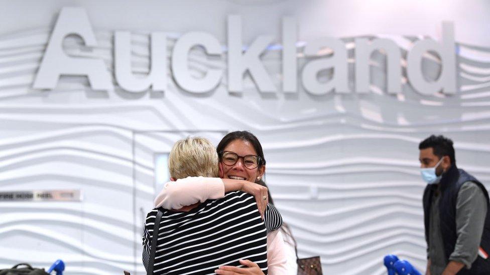 Passengers from Australia are greeted by friends and relatives at Auckland Airport on April 19, 2021 in Auckland, New Zealand.