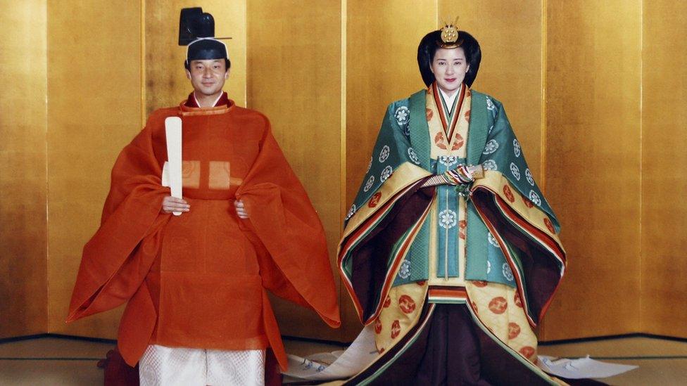 In this handout photo from the Imperial Household Agency, Crown Prince Naruhito of Japan and his future wife Masako Owada pose for photographs in traditional Japanese costume prior to their wedding 2 June 1993 in Tokyo