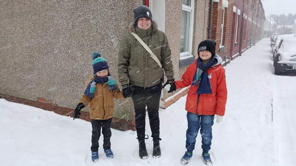 Kat with her sons in the snow