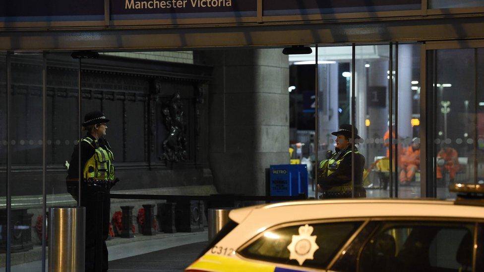 Officers on guard inside the station