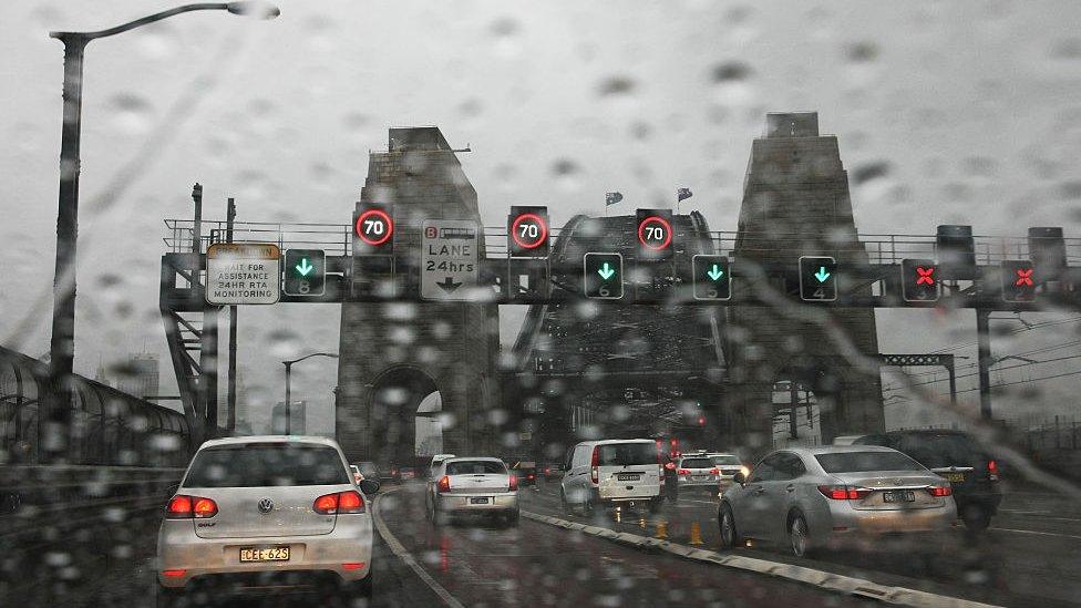 Heavy traffic across the Harbour Bridge on a rainy day