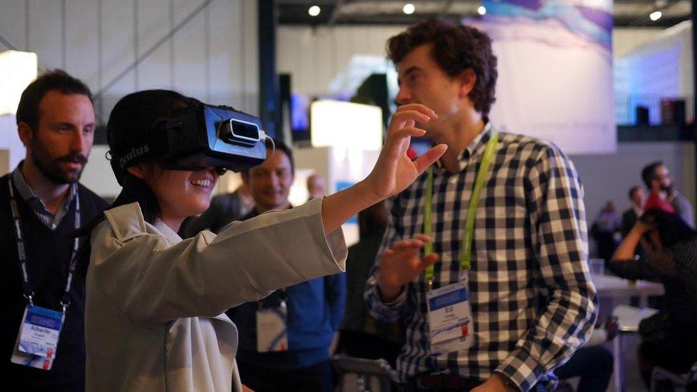 Woman wearing Deloitte's VR headset