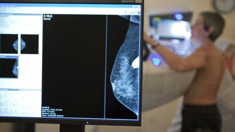 A woman having a mammogram