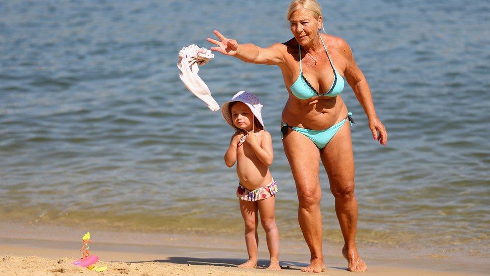 Grandmother and granddaughter take a dip in the water at Red Leaf Beach on January 15, 2019 in Sydney, Australia