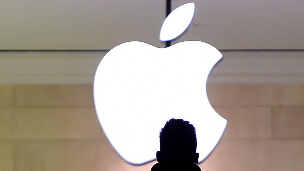 A man walks up the stairs at the Apple Store in Grand Central Station February 25, 2016