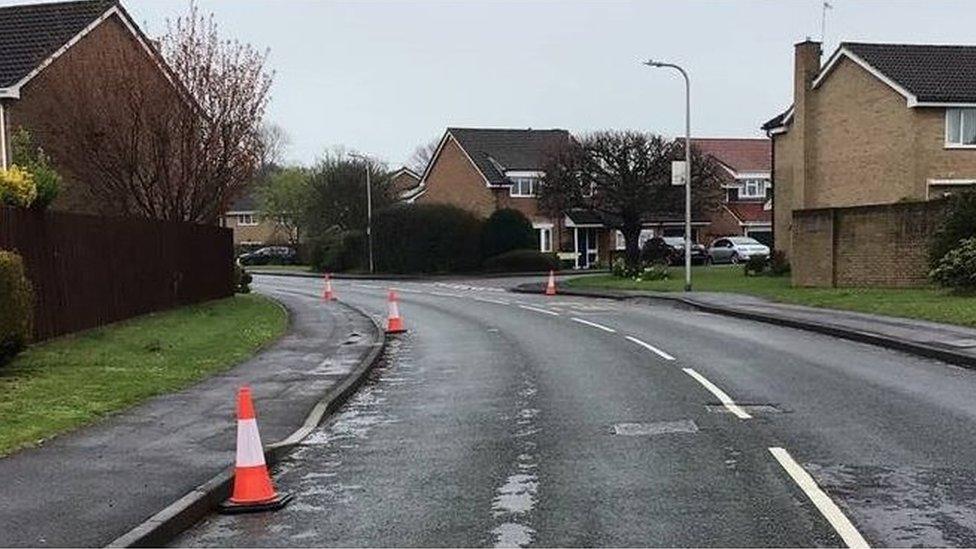 Road with gully covers missing