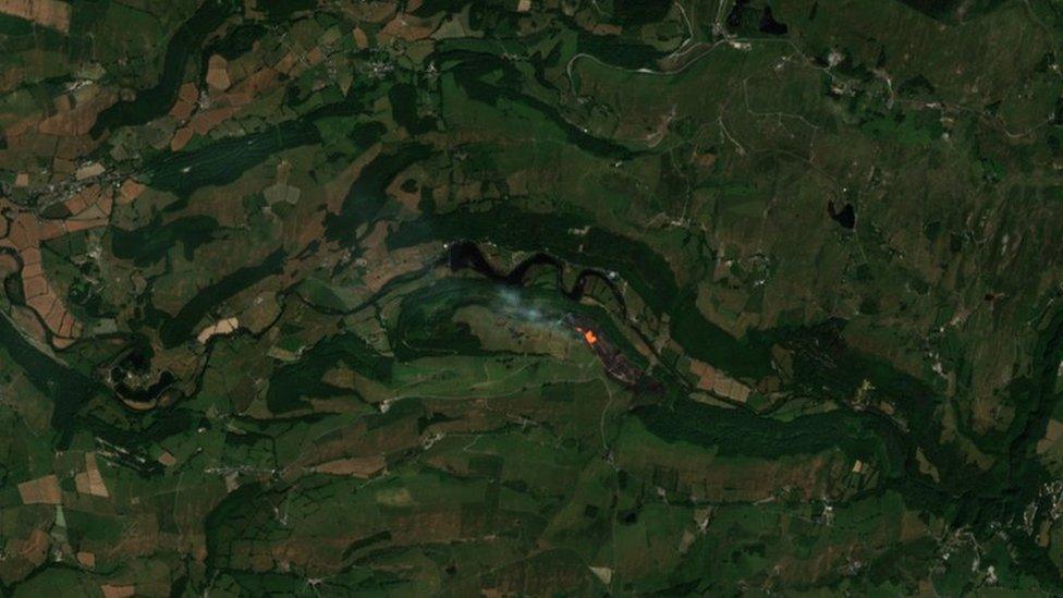 A satellite image of the fire in Cwm Rheidol on Wednesday around midday when the satellite passed over the area. The grey area is the ‘burn scar’ and the orange is the still burning fire.