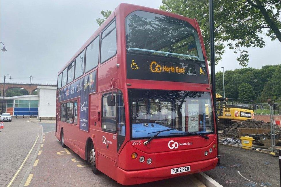 A red Go North East double decker bus