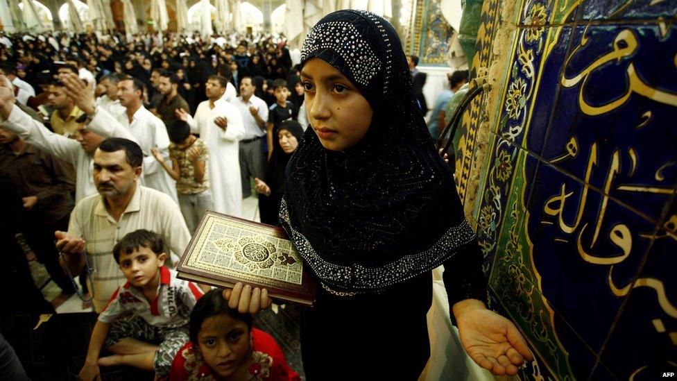 Shia Muslims pray at the shrine of the Imam Ali in the Iraqi city of Najaf during Laila al-Qadr (Night of Power), when Muslims believe the Koran was first revealed to the Prophet Muhammad 10 July 2015