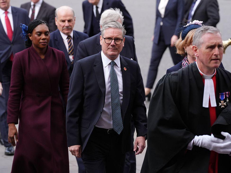 Prime Minister Sir Keir Starmer, followed by Conservative Party leader Kemi Badenoch, arrive to attend a Service of Thanksgiving at Westminster Abbey in London on the 80th anniversary of VE Day. Picture date: Thursday May 8, 2025.
