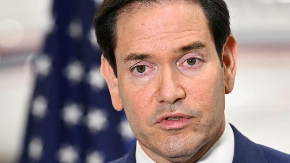 US Secretary of State Marco Rubio speaks to traveling journalists at an airport in Canada on 12 November after the G7 foreign ministers meeting. 