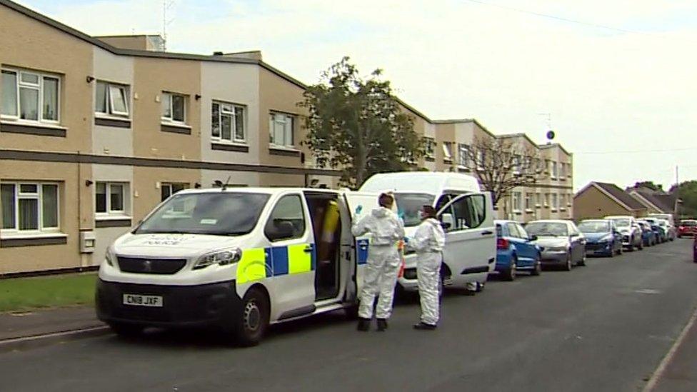 Police outside the block of apartments