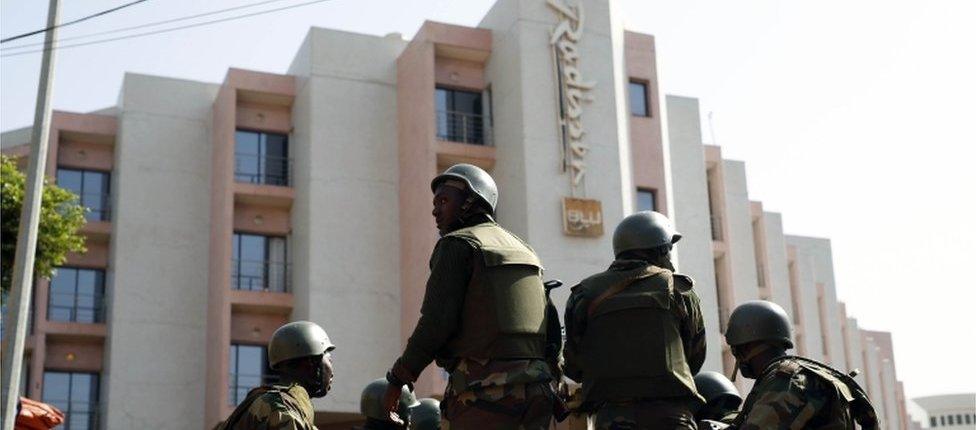 Soldiers from the presidential patrol outside the Radisson Blu hotel in Bamako, Mali, Saturday, Nov. 21, 2015