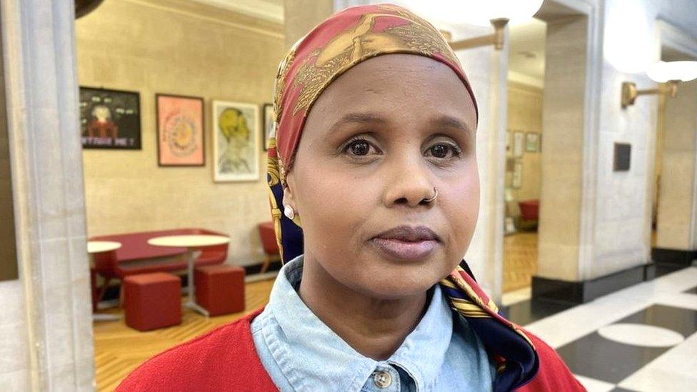 Fatima looking at the camera standing inside City Hall in Bristol