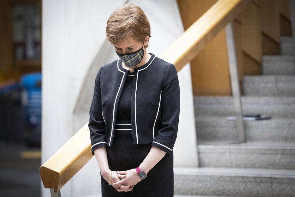 Nicola Sturgeon bows her head during a minute's silence