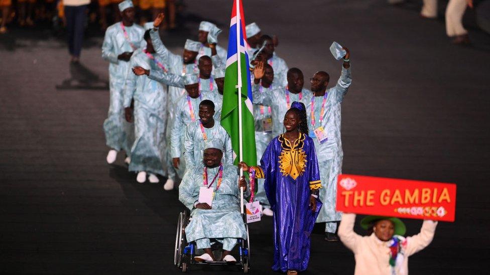 Flag Bearers of Team Gambia lead their team out during the Opening Ceremony of the Birmingham 2022 Commonwealth Games at Alexander Stadium on July 28, 2022