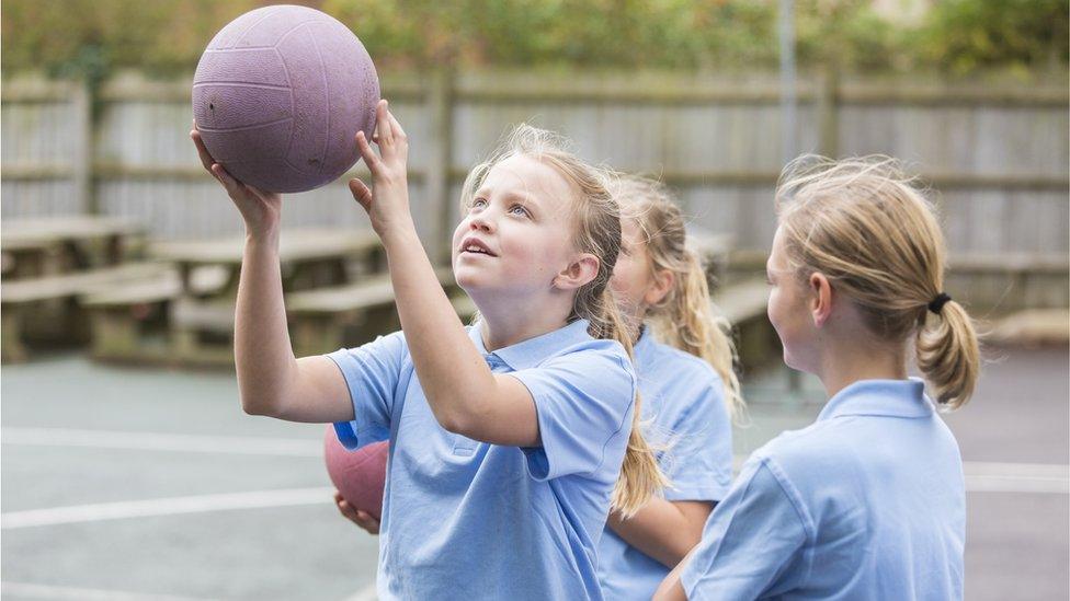 Girls playing netball