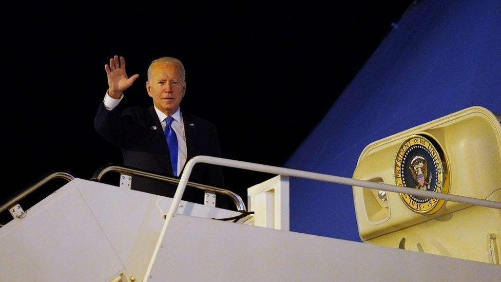 US President Joe Biden waves from Air Force One as he departs Edinburgh