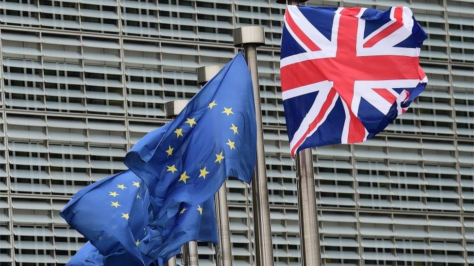 Union Jack and EU flags fly at Brussels