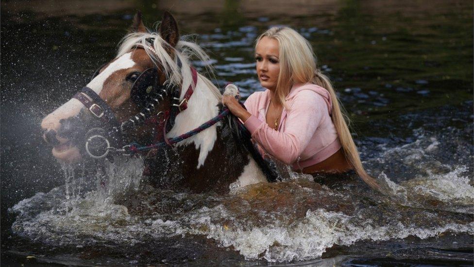 Girl on horse in river