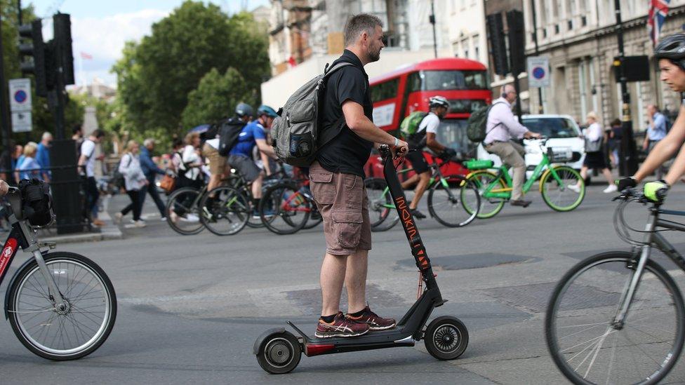 Man on an e-scooter in London