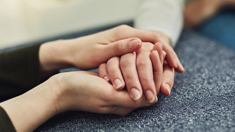 Stock image of holding hands