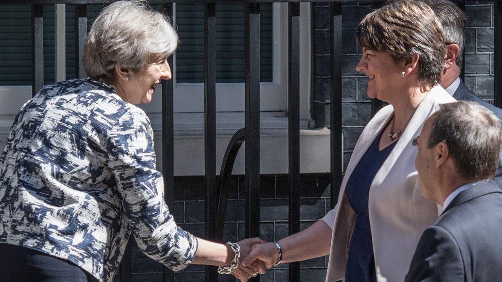 UK PM Theresa May and DUP leader Arlene Foster shake hands outside Downing Street on 26 June 2017