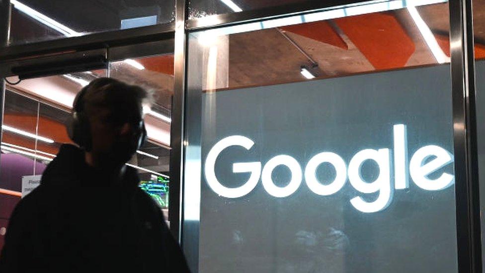 A person walks past the entrance to a Google building GRCQ1 in Grand Canal area, Dublin.